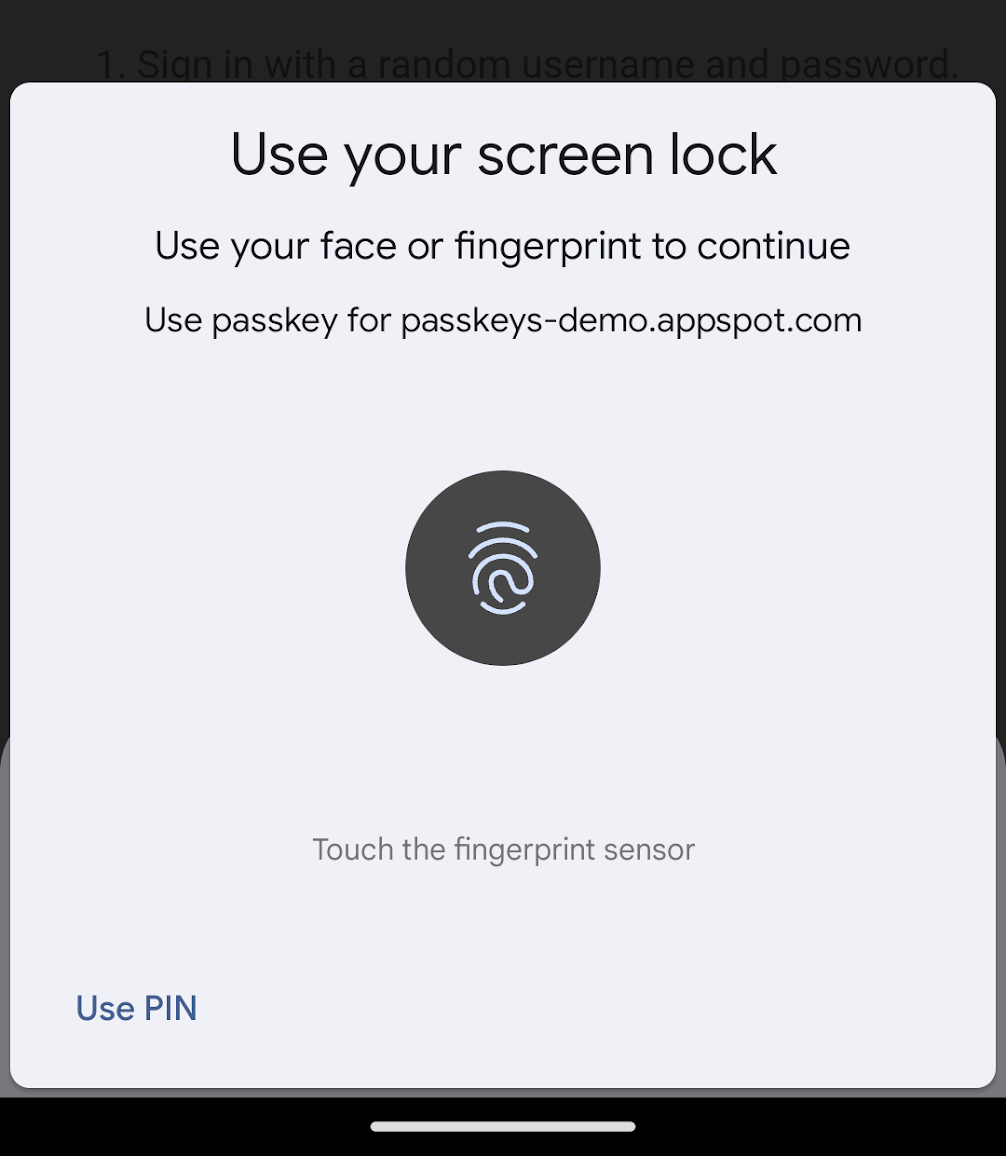 Android এর জন্য Chrome-এ ব্যবহারকারী যাচাইকরণ ডায়ালগের একটি স্ক্রিনশট। ডায়ালগটি ব্যবহারকারীকে মুখের স্বীকৃতি বা আঙুলের ছাপ সনাক্তকরণ ব্যবহার করে তাদের পরিচয় যাচাই করতে অনুরোধ করে এবং প্রমাণীকরণের অনুরোধের উত্স প্রদর্শন করে। নীচে বাম দিকে একটি পিন ব্যবহার করে যাচাই করার একটি বিকল্প রয়েছে৷
