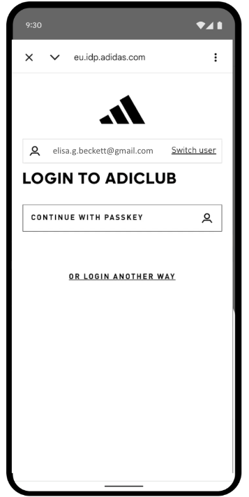 adidas 移动应用登录界面，其中包含一个专用“使用通行密钥继续”按钮，可提供简化的身份验证体验。